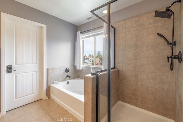 bathroom with a shower stall, visible vents, a bath, and tile patterned floors