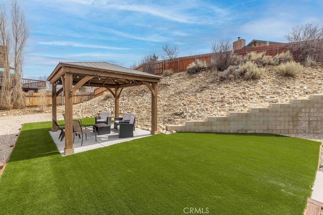 view of yard with a gazebo, a fenced backyard, and a patio