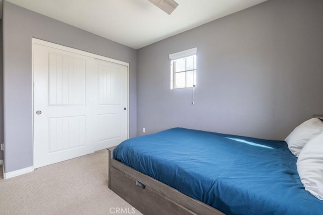 bedroom with carpet floors and a closet