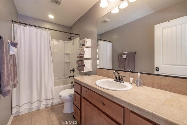 bathroom with visible vents, toilet, shower / bath combo, vanity, and tile patterned flooring