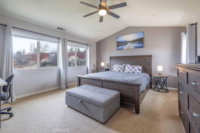 bedroom featuring lofted ceiling, baseboards, visible vents, and light colored carpet