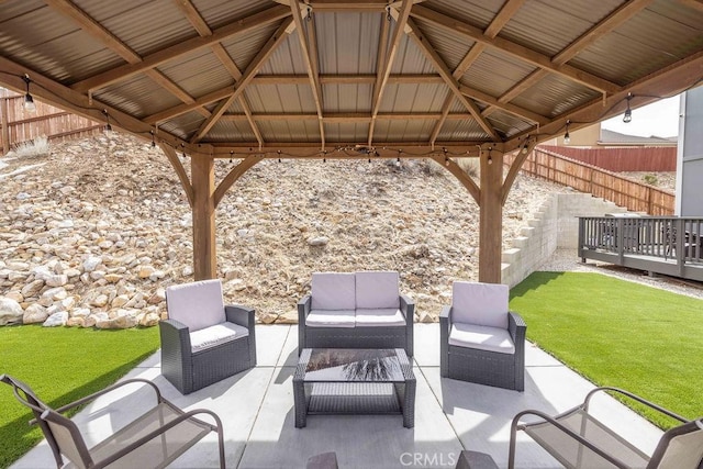 view of patio with a fenced backyard, a gazebo, and an outdoor hangout area