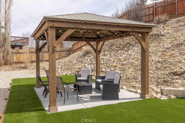 view of patio / terrace featuring fence and a gazebo