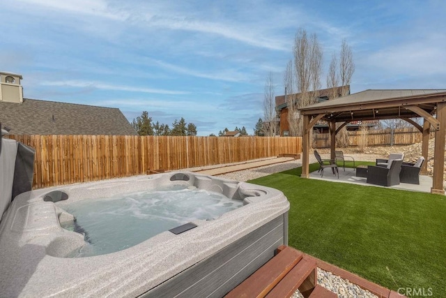 view of yard featuring a hot tub, a gazebo, an outdoor hangout area, a patio area, and a fenced backyard