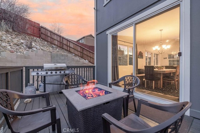 balcony featuring a grill and a fire pit