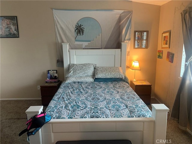 bedroom with carpet floors and baseboards