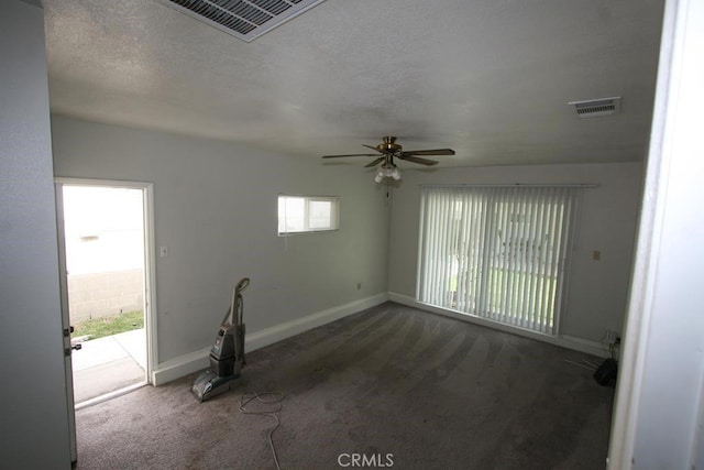 empty room featuring baseboards, visible vents, and carpet flooring