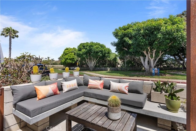 view of patio featuring an outdoor hangout area and fence