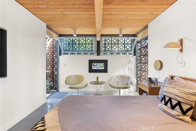 bedroom featuring baseboards, wood ceiling, and floor to ceiling windows