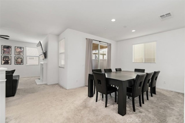 dining area with visible vents, baseboards, a ceiling fan, light colored carpet, and recessed lighting