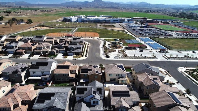 birds eye view of property with a residential view and a mountain view