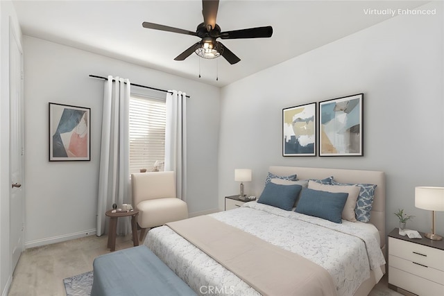 bedroom with a ceiling fan and baseboards