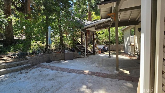 view of patio featuring fence