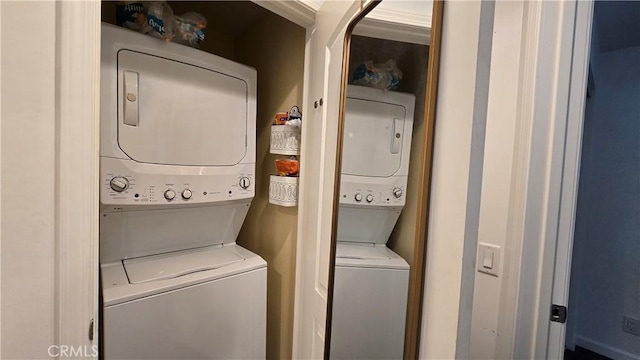 laundry area with laundry area and stacked washing maching and dryer