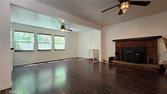 living area with ceiling fan, wood finished floors, and baseboards