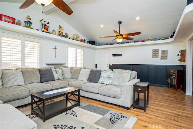 living room featuring a ceiling fan, recessed lighting, vaulted ceiling, and light wood finished floors