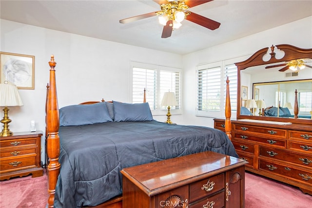 bedroom featuring visible vents, a ceiling fan, and carpet flooring