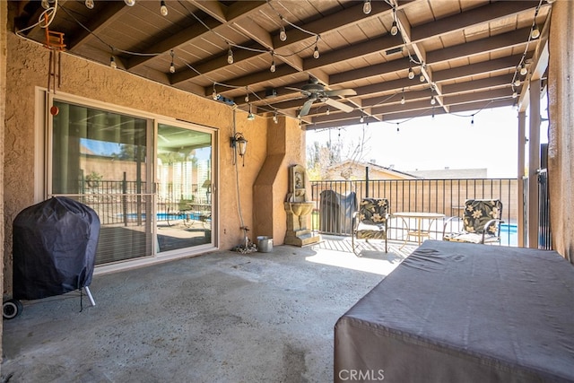 view of patio featuring grilling area and a ceiling fan