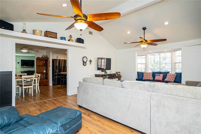 living room with light wood finished floors, recessed lighting, visible vents, a ceiling fan, and vaulted ceiling