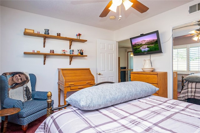 bedroom with visible vents and a ceiling fan