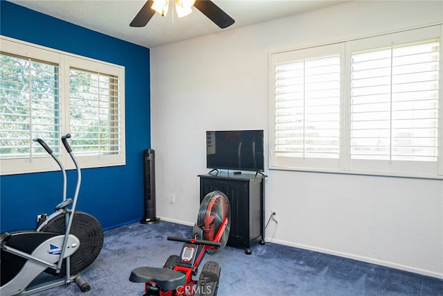 workout room featuring carpet, ceiling fan, and baseboards