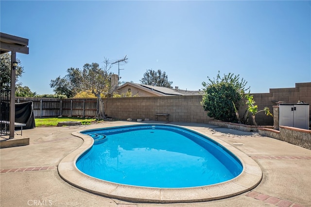 view of swimming pool featuring a patio, a fenced backyard, and a fenced in pool