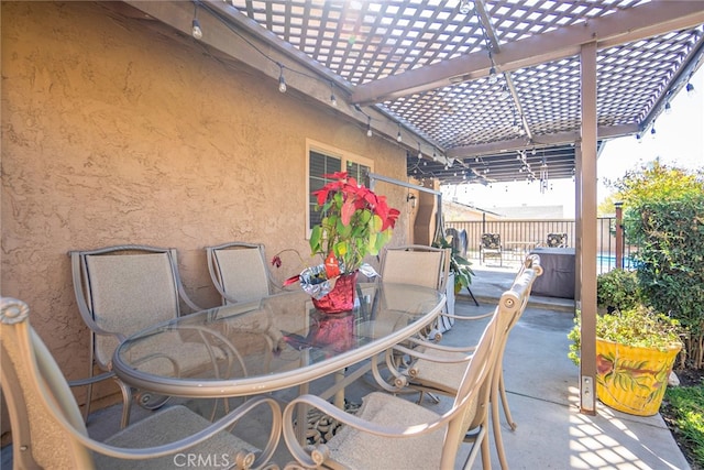 view of patio featuring outdoor dining space, fence, and a pergola