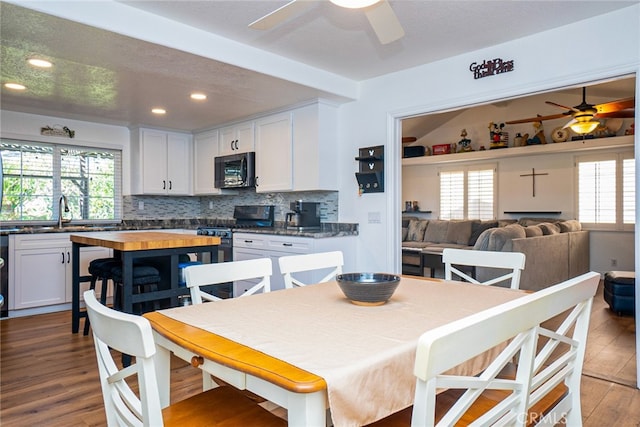 dining space featuring ceiling fan, plenty of natural light, dark wood finished floors, and recessed lighting