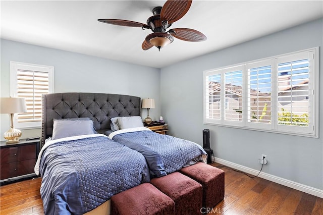 bedroom featuring baseboards, ceiling fan, and hardwood / wood-style floors