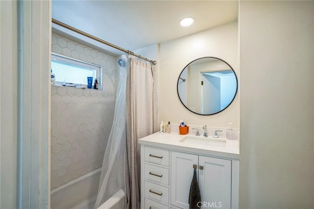 bathroom featuring vanity and shower / tub combo with curtain