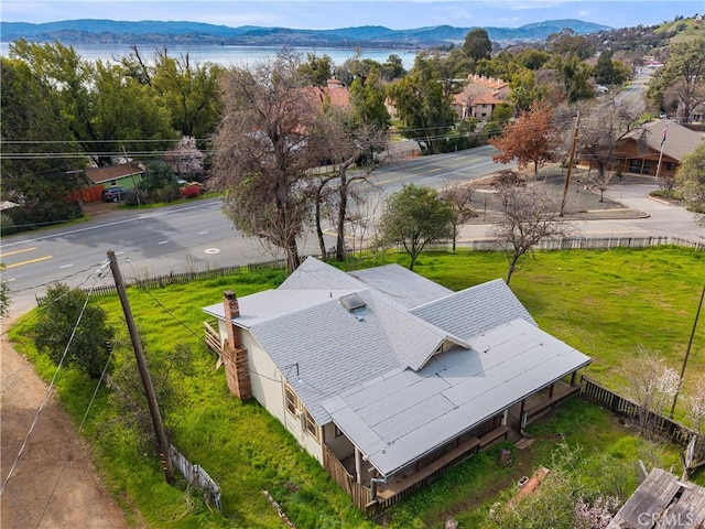 birds eye view of property featuring a water and mountain view