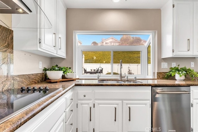 kitchen with black electric stovetop, stainless steel dishwasher, white cabinetry, a sink, and under cabinet range hood