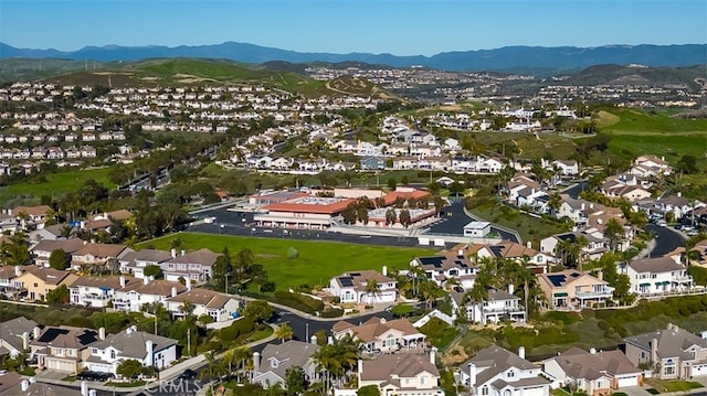 birds eye view of property with a residential view and a mountain view