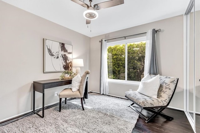 office with baseboards, a ceiling fan, and wood finished floors