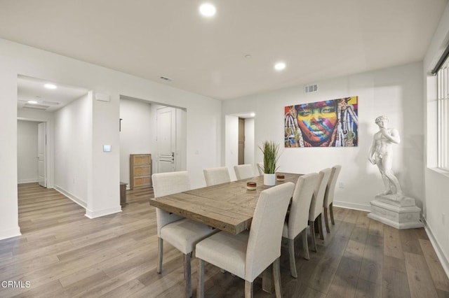 dining space with recessed lighting, visible vents, light wood-style flooring, and baseboards