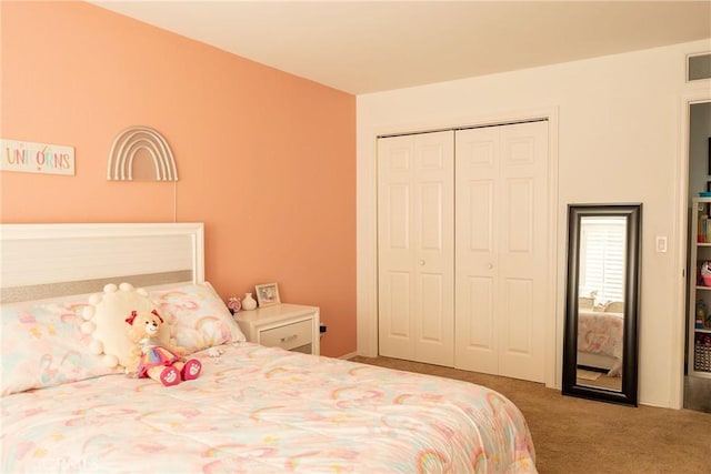 bedroom with a closet and carpet flooring