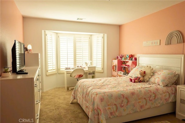 bedroom with light colored carpet and visible vents