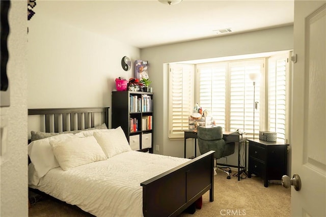 bedroom with carpet floors and visible vents