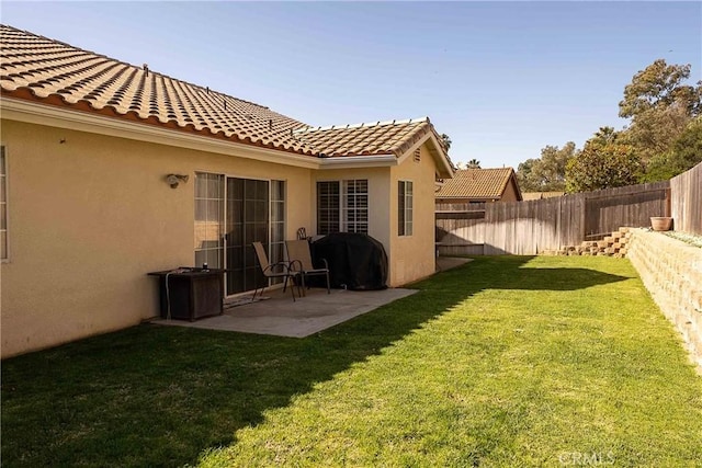 view of yard featuring a fenced backyard and a patio