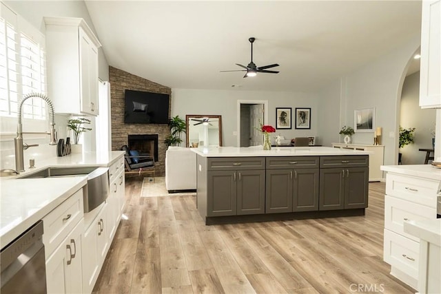 kitchen featuring ceiling fan, white cabinetry, open floor plan, gray cabinets, and dishwasher