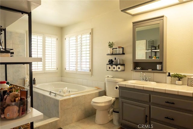 full bathroom with vanity, tile patterned flooring, a garden tub, and toilet