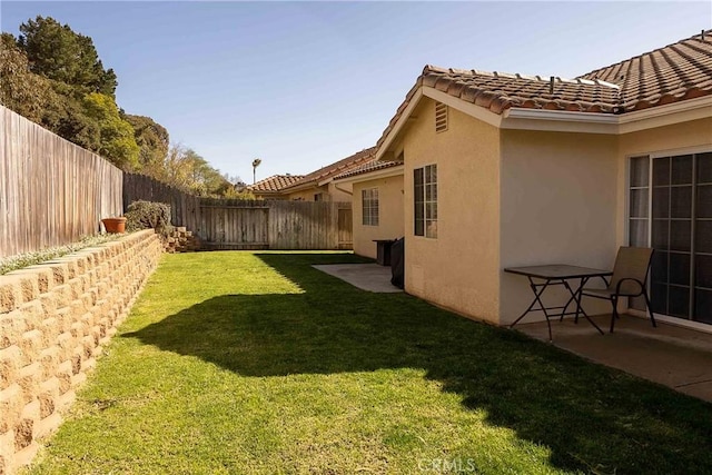 view of yard with a fenced backyard