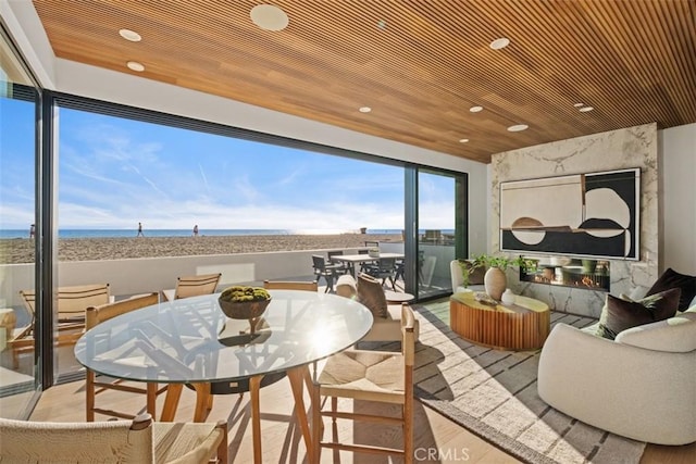 interior space featuring outdoor dining area and a water view