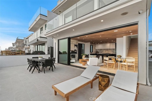 view of patio featuring outdoor dining area