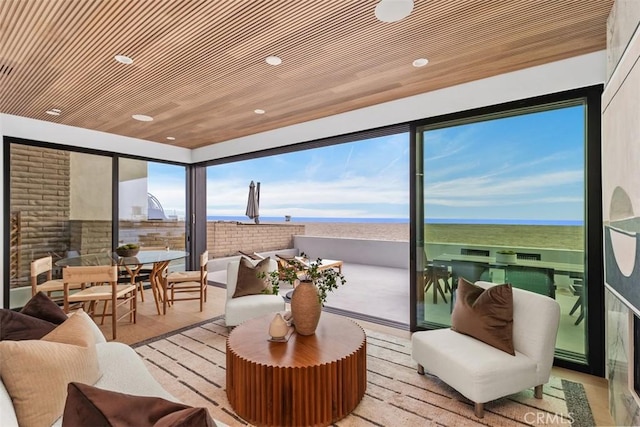 sunroom / solarium featuring wooden ceiling