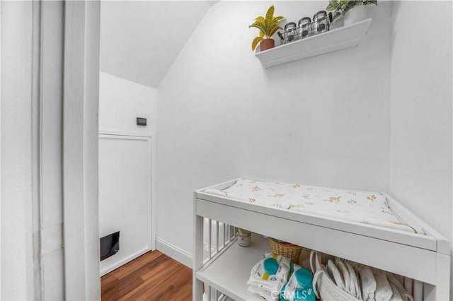 washroom with laundry area and wood finished floors