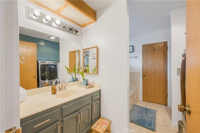 bathroom featuring a bath, tile patterned flooring, and vanity