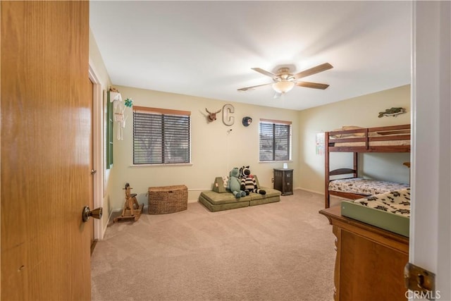 carpeted bedroom featuring ceiling fan