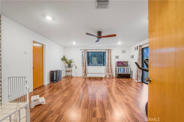 unfurnished living room with light wood-style flooring, visible vents, ceiling fan, and recessed lighting