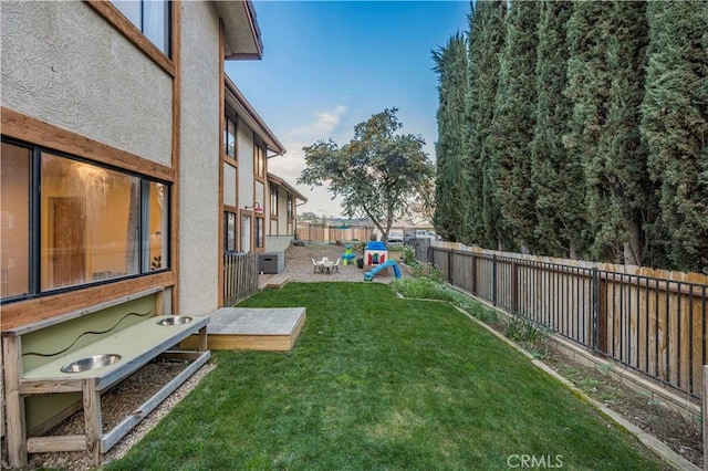 view of yard featuring a patio area and a fenced backyard